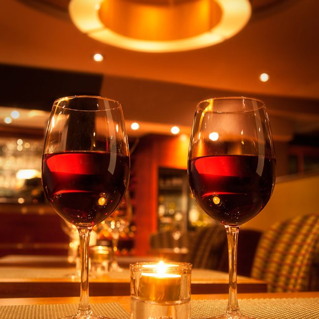 Two Wine Glasses on a Restaurant Table Photograph by Norton Photography and Retouching